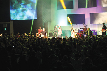 Teenagers worship at an Ozark Christian College weekend event planned especially for them. Ozark hosts three such events each year—two for older teens and one for younger teens. The events not only help the teens dig deeper into the Word and faith, but also introduce them to a Christian college campus.